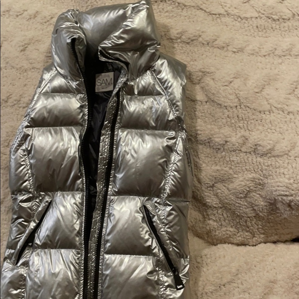 a silver shiny sam vest!!!